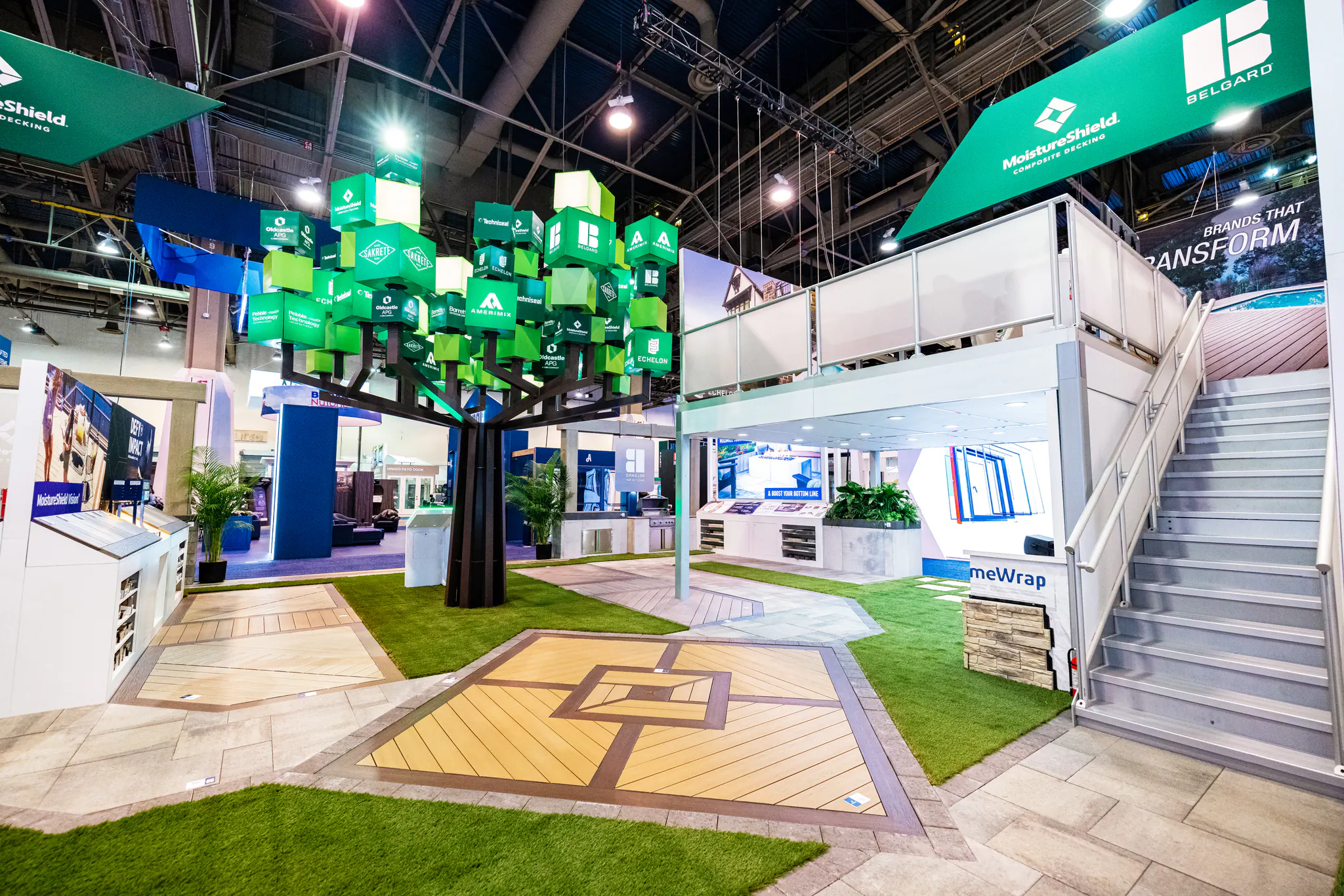 Oldcastle APG exhibit with a sculptural brand tree, product pathways and double-deck hospitality.