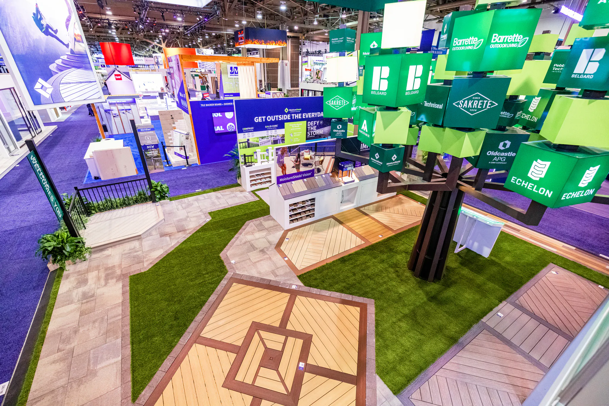 Overhead view of the Oldcastle APG exhibit’s brand tree and patterned product pathways.
